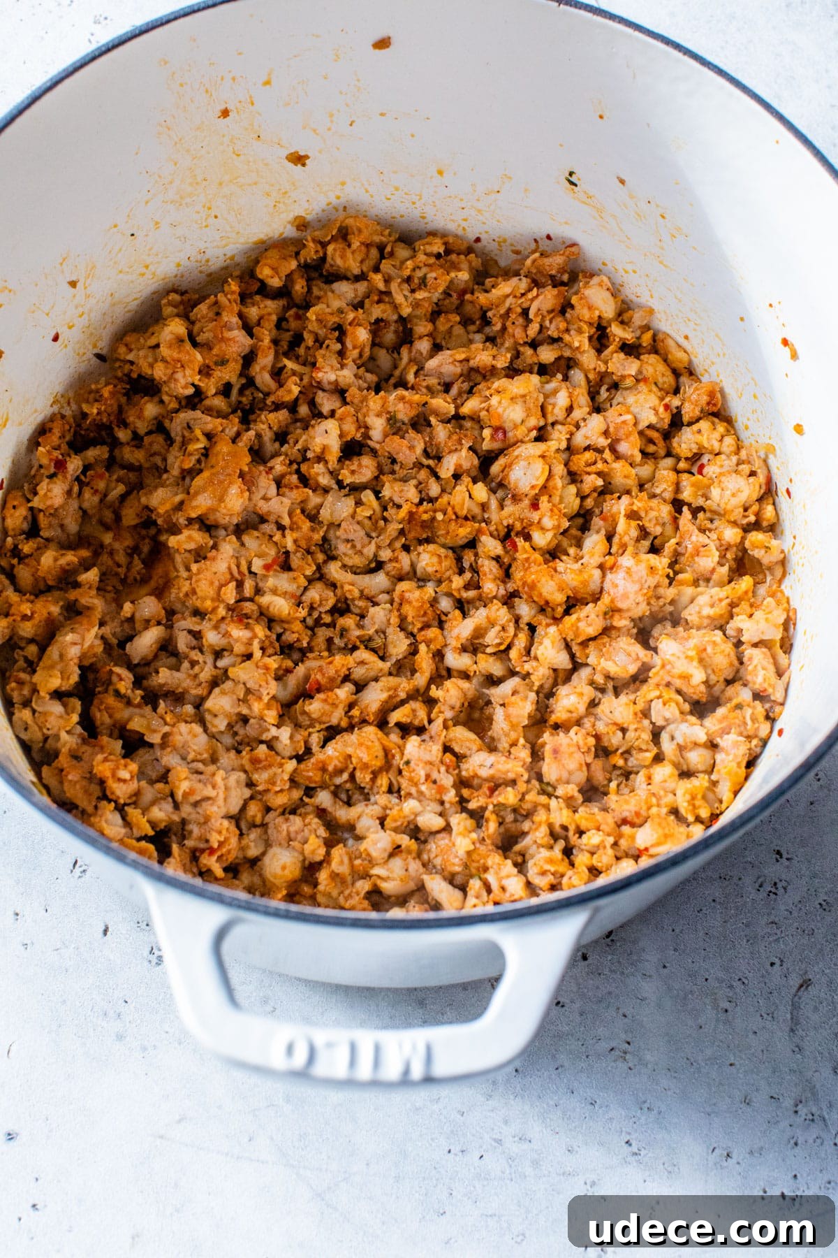 sausage cooking in a dutch oven