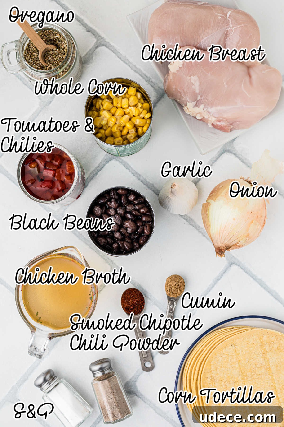 An overhead view of the ingredients that would be needed to make a slow cooker chicken tortilla soup recipe.