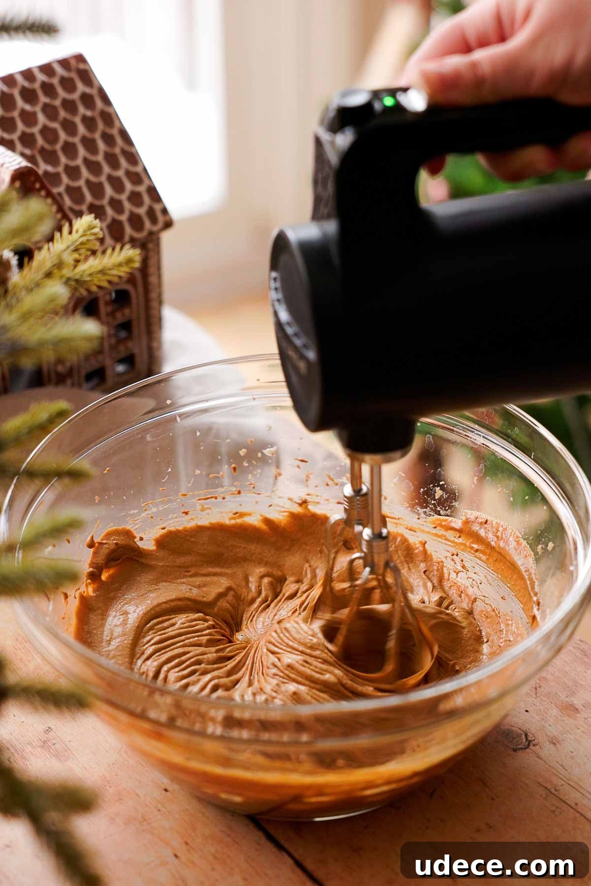 beating wet ingredients in large bowl for molded gingerbread cookies