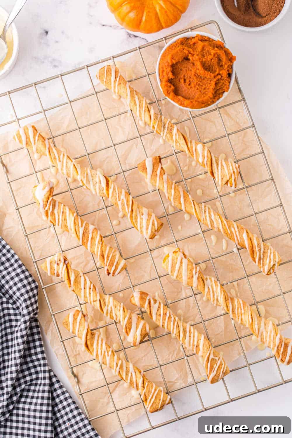 Air fryer pumpkin pie twists on a cooling rack.