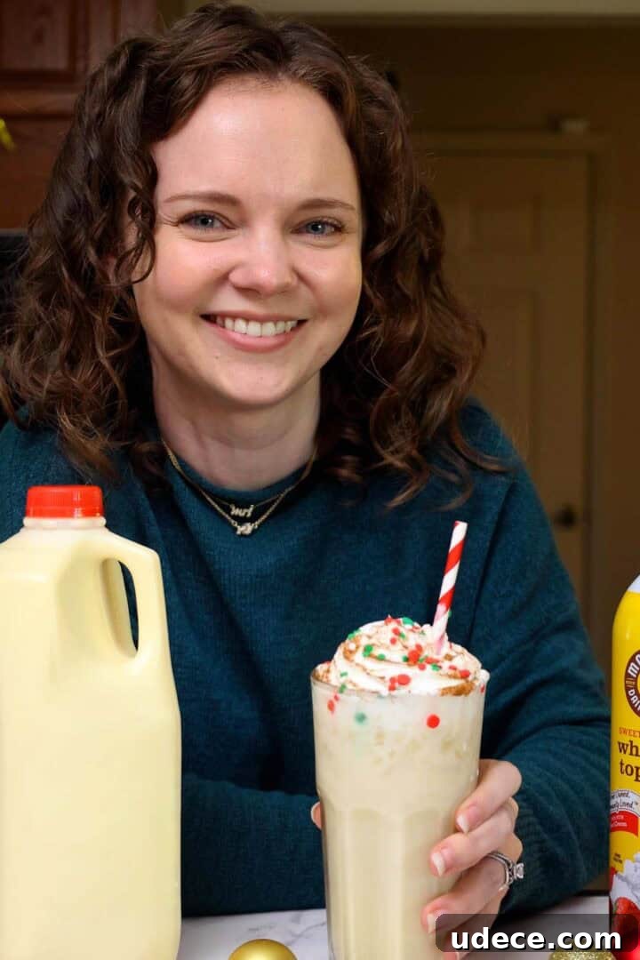 Kelsey Smith with a glass of eggnog dirty soda in hand.