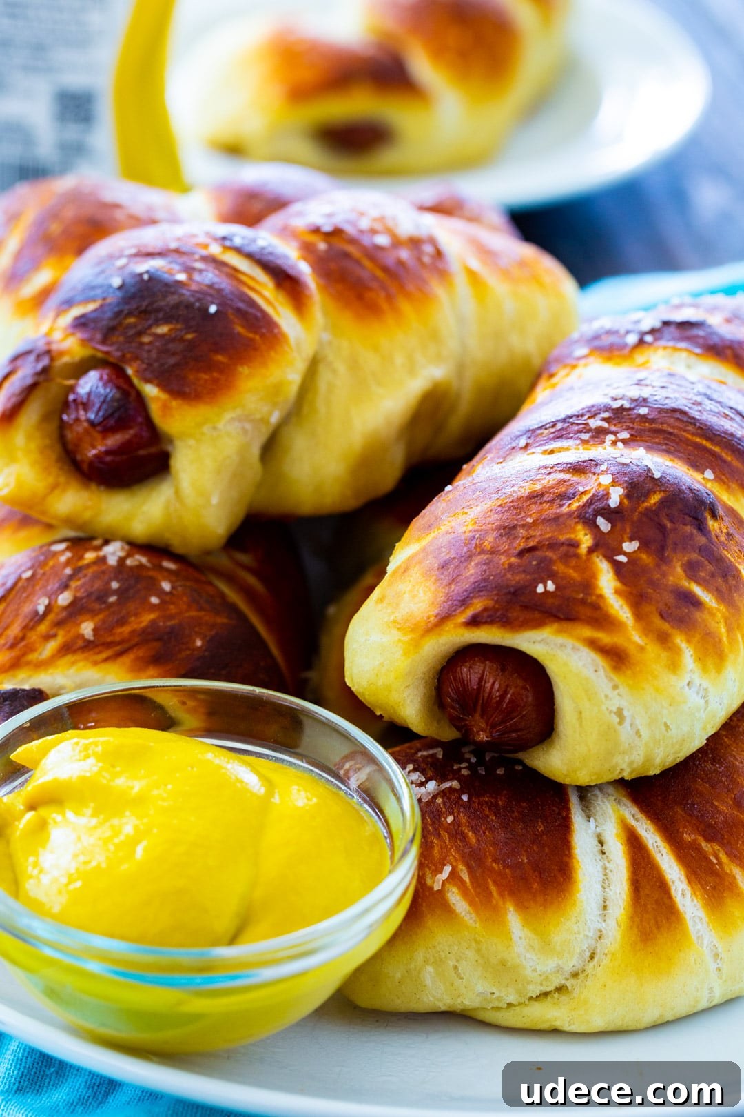 Pretzel Dogs piled on a plate.