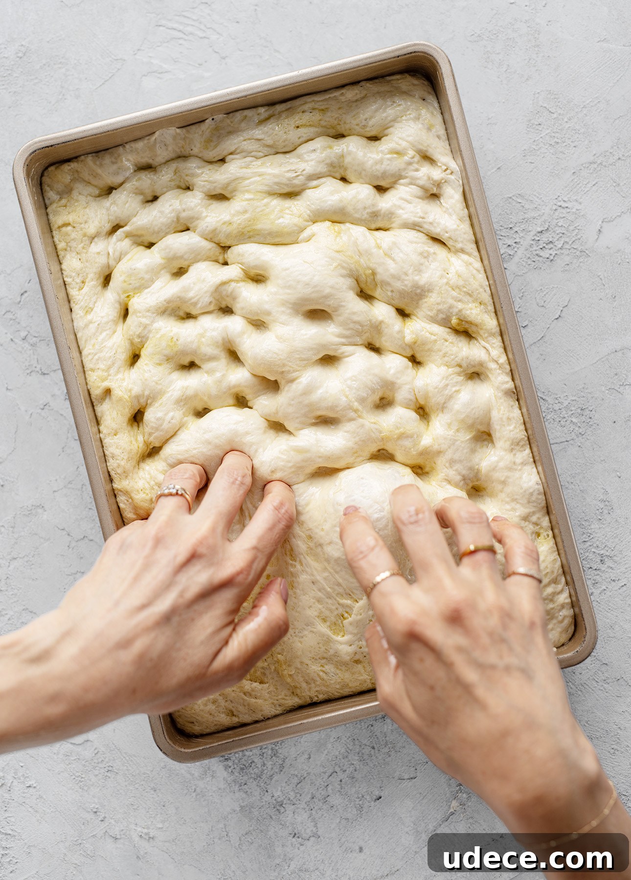 Creating dimples in focaccia dough