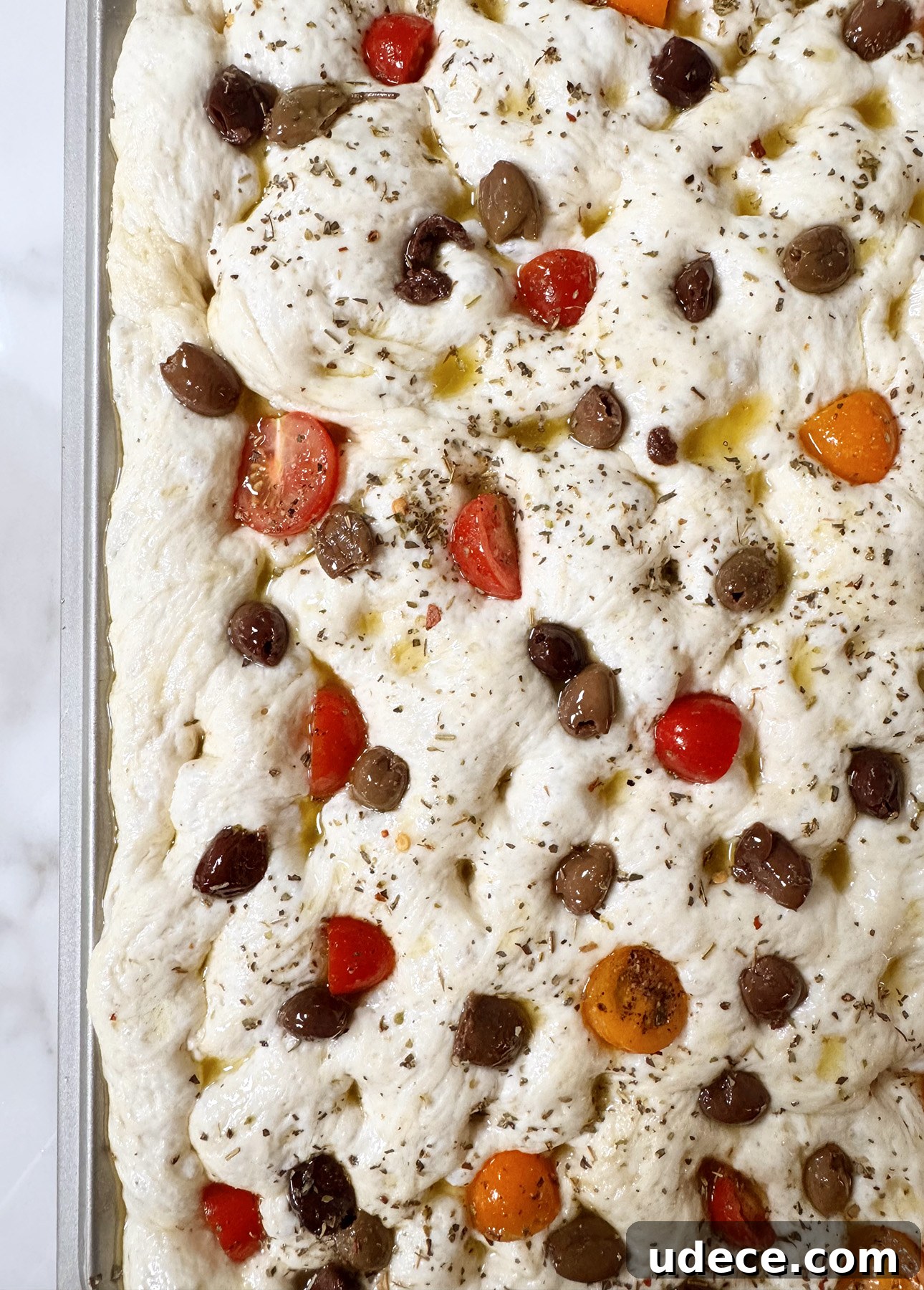 Focaccia topped with olives and cherry tomatoes
