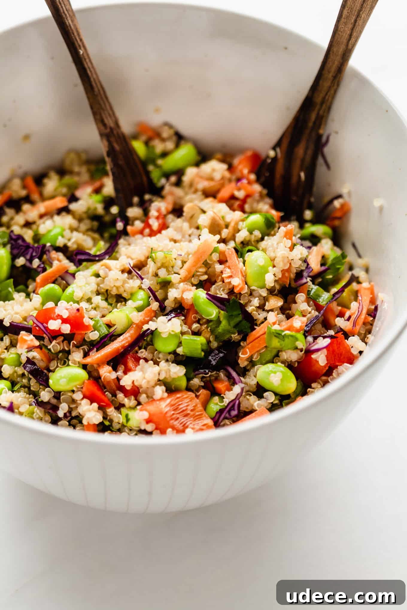 a mixing bowl with edamame and quinoa salad
