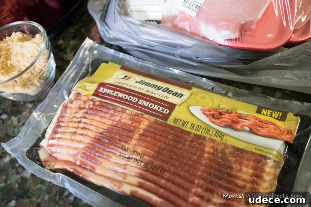 A dinner that will leave them asking for more! This simple Crockpot Bacon Wrapped Pork Chops Recipe is a keeper! 