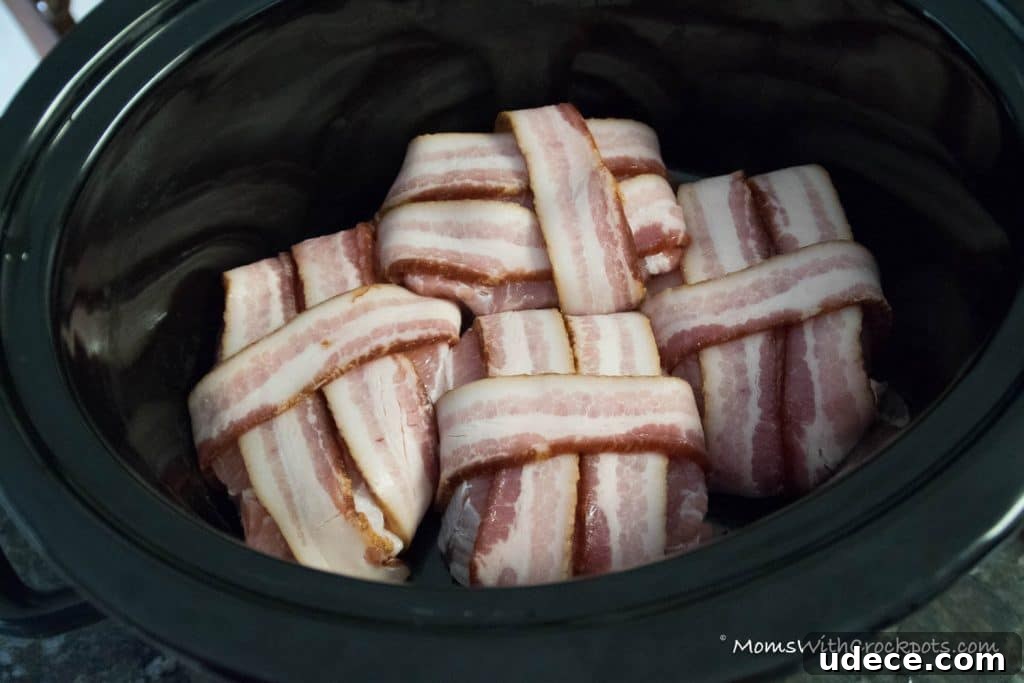 A dinner that will leave them asking for more! This simple Crockpot Bacon Wrapped Pork Chops Recipe is a keeper! 
