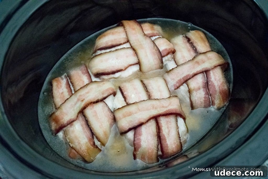 A dinner that will leave them asking for more! This simple Crockpot Bacon Wrapped Pork Chops Recipe is a keeper! 