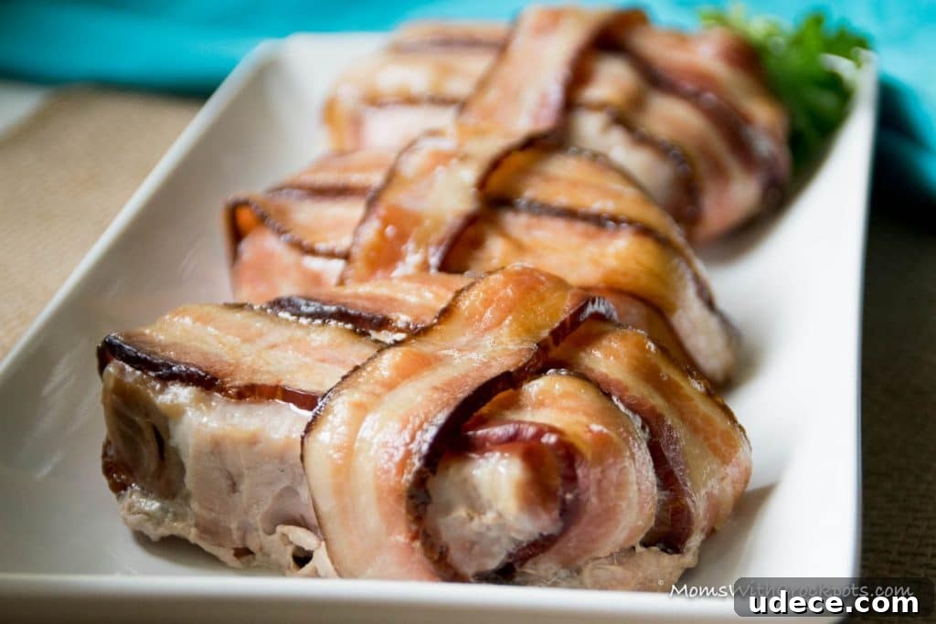A dinner that will leave them asking for more! This simple Crockpot Bacon Wrapped Pork Chops Recipe is a keeper! 
