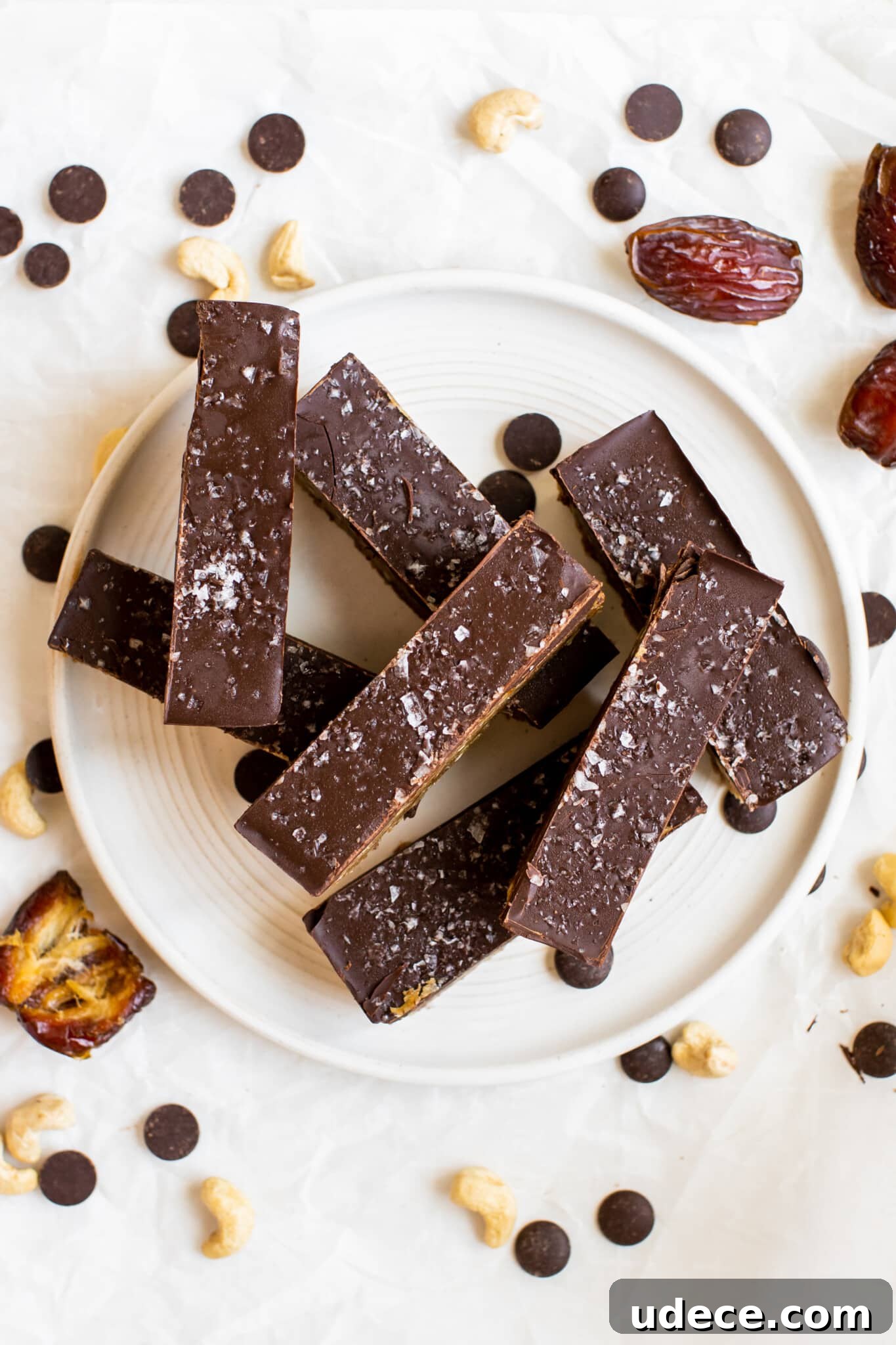 homemade protein bars stacked on a white plate