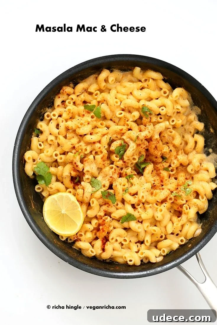 Masala Mac and Cheese! Garam masala spice blend, cumin, fennel, cayenne, nigella and fenugreek seeds in this Indian Spiced cheese sauce. | Vegan recipe