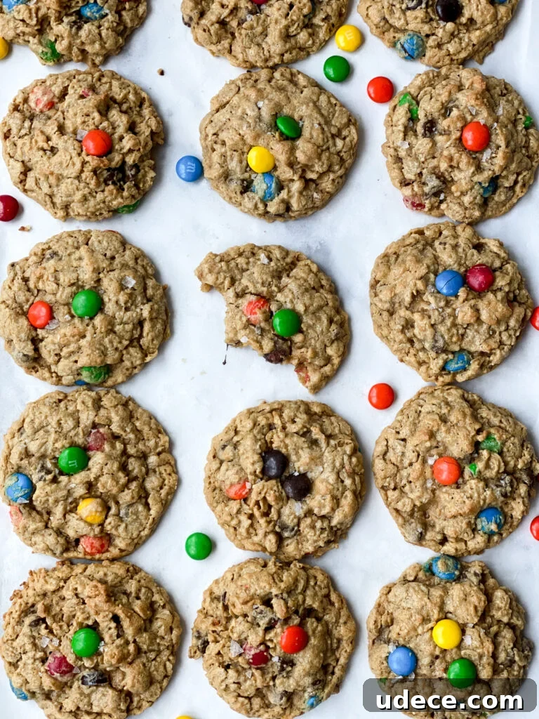 Chewy Monster cookies with a piece missing from one