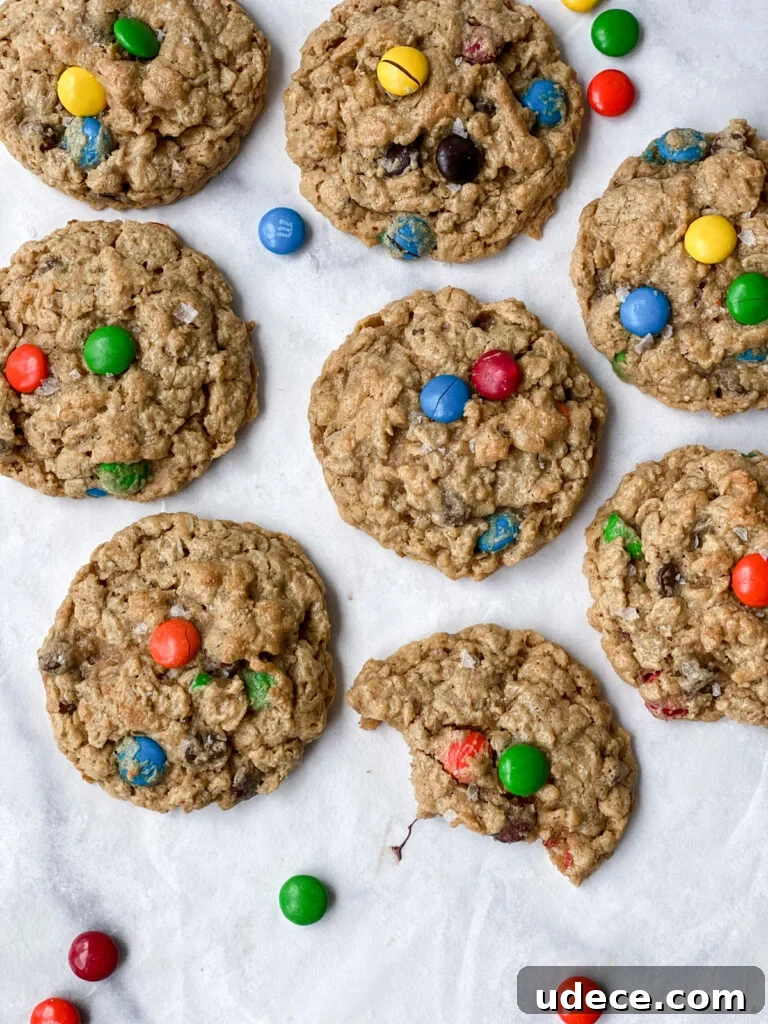 scattered chewy monster cookies with m&m's around them